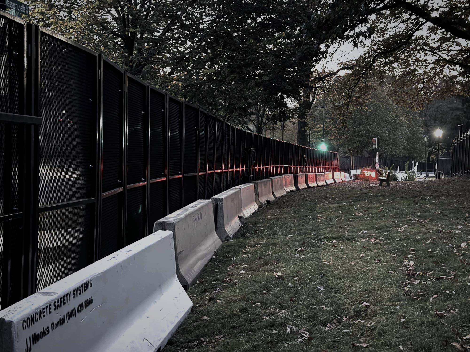 Illuminated RMR Pro perimeter with concrete barriers at night