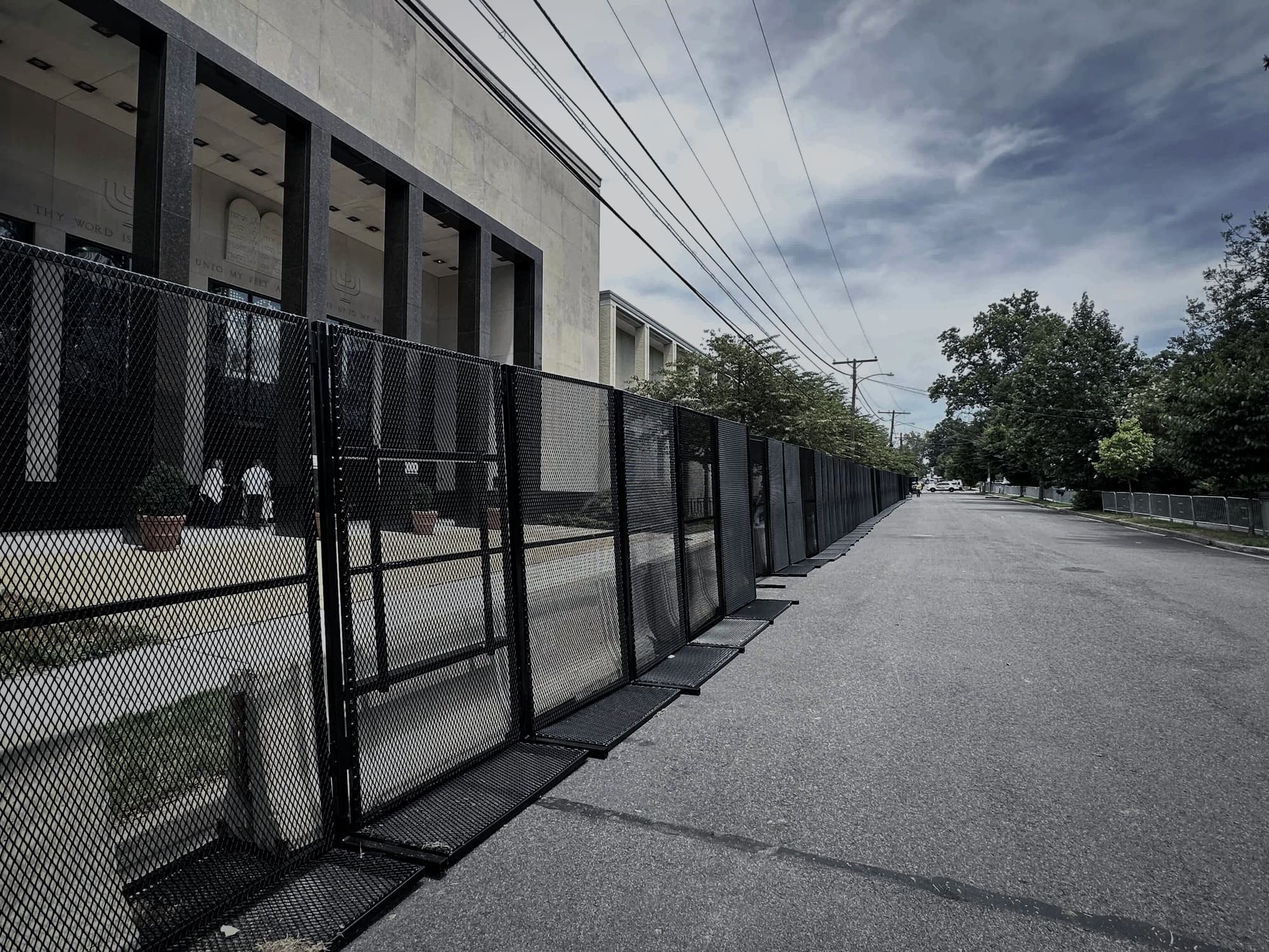 Secured urban street with RMR Pro perimeter fencing and vehicle checkpoint
